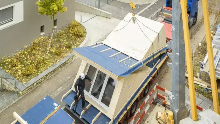 Dachaufstockung-Holzelementbau_Sommergasse-Allschwil-v3__FillWzcwNiw0MDBd.jpg